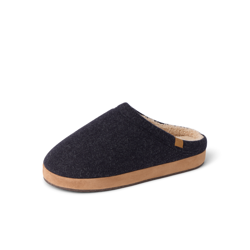 Eventide Slipper in black, shown facing left from the side with a closed toe and open heel