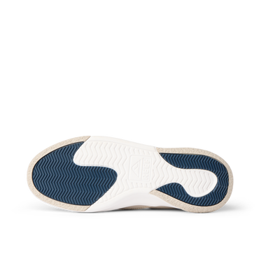 Del Mar Slip On close-up, outsole facing left with blue traction tread and supportive molded footbed