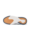 Del Mar Slip On close-up from below, toe facing left, showing orange traction tread and white cushioned sole