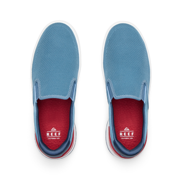 Del Mar Slip On blue slip on sneakers viewed from above with toes facing upward and cushioned footbeds visible