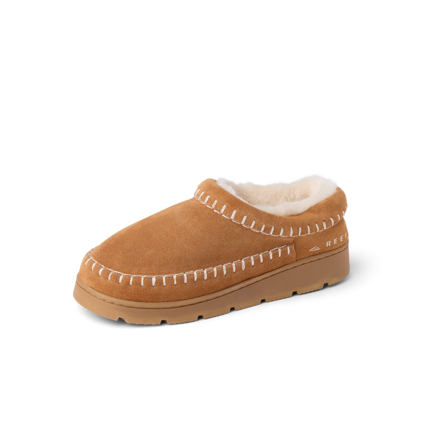 Noa Slipper facing left with tan suede, plush lining, whipstitch detailing, and cushioned sole for everyday comfort