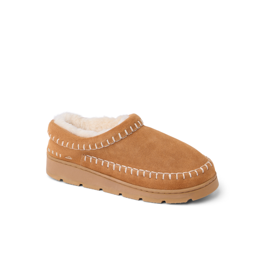 Noa Slipper in tan suede facing right with whipstitch detailing and cozy lining
