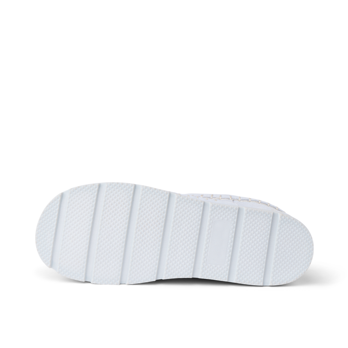 Noa Slipper outsole close up facing right with textured white tread and deep traction grooves