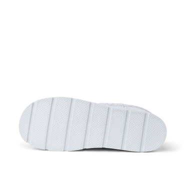 Noa Slipper outsole close up facing right with textured white tread and deep traction grooves