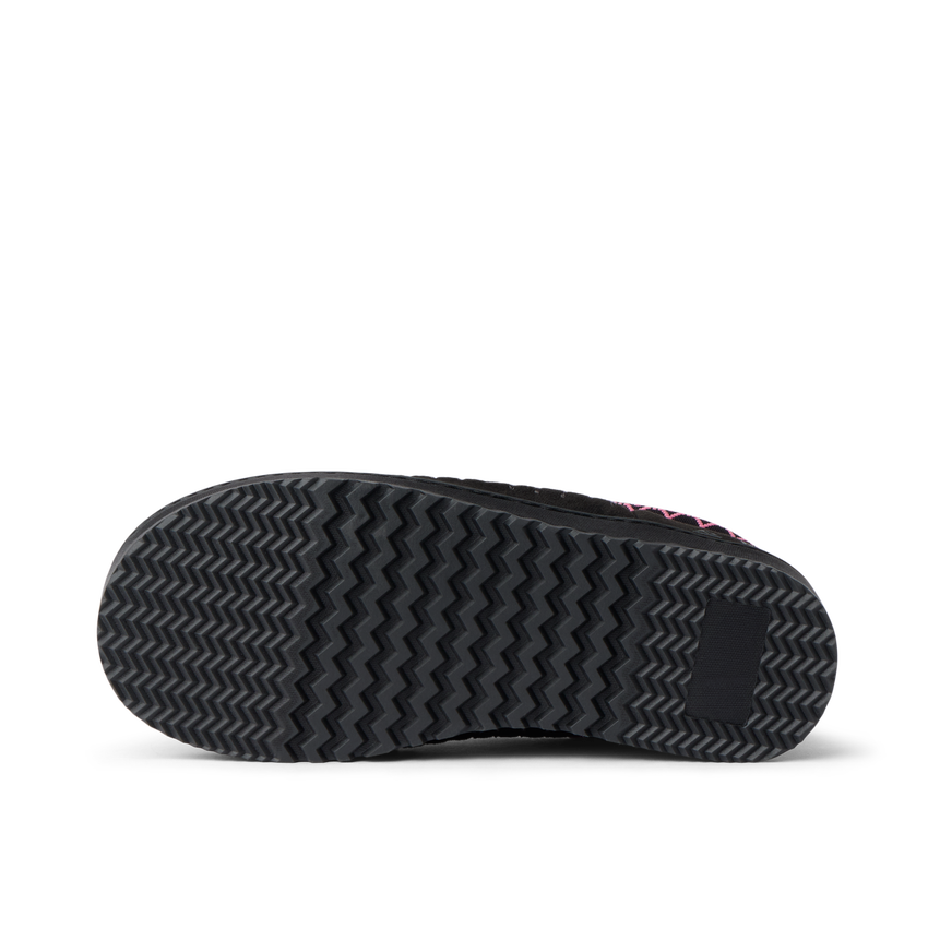 Indie Slipper close up showing the textured bottom sole facing the viewer for traction