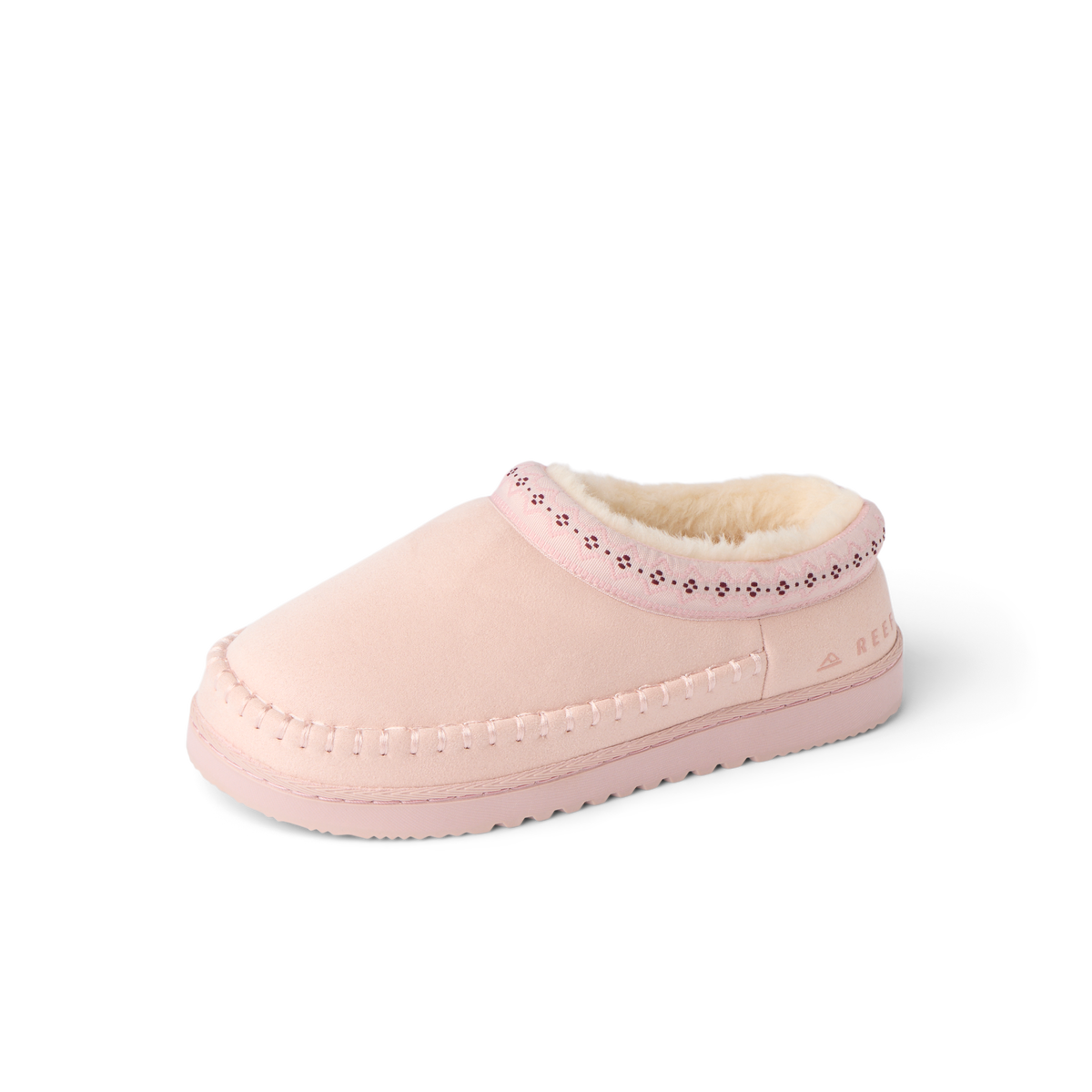 Indie Slipper facing left, showing its cushioned toe, stitched side, and soft fleece lining