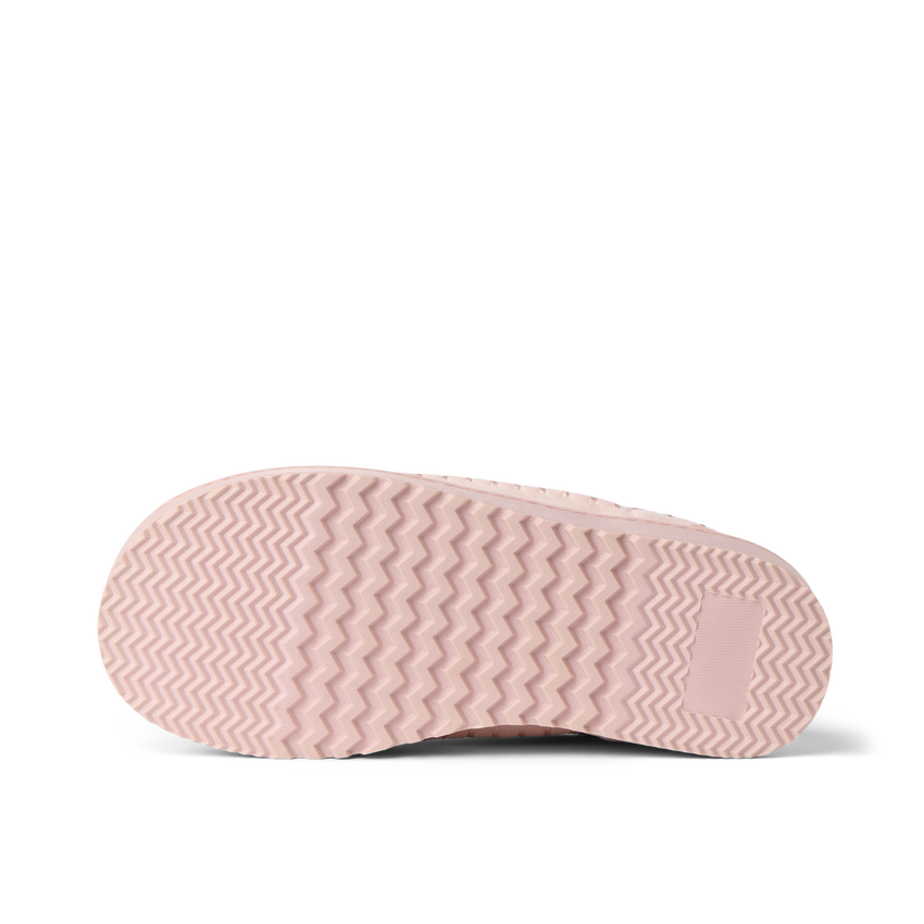 Indie Slipper outsole close up, toe facing left, textured tread for comfortable beach wear