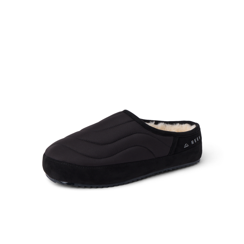 Willa Slipper facing left with a quilted black upper and plush faux fur lining