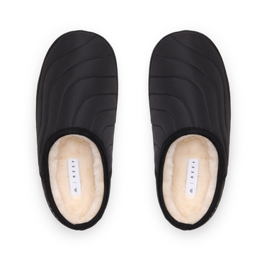 Willa Slipper black quilted pair facing upward with plush faux fur lining and cushioned comfort