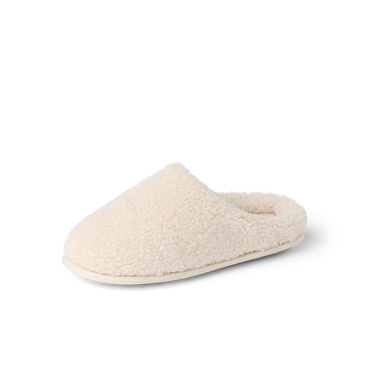 Daydream Slipper in cream faux shearling, toe facing left, showing the full cozy mule shape