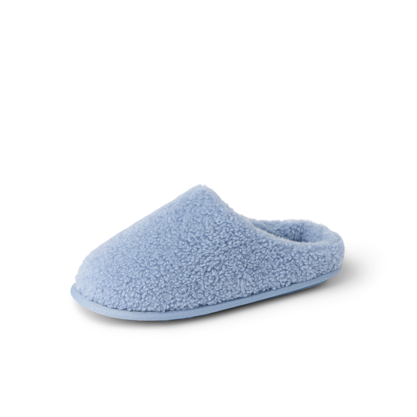 Daydream Slipper in soft faux shearling, facing left, side view with open heel and cushioned footbed