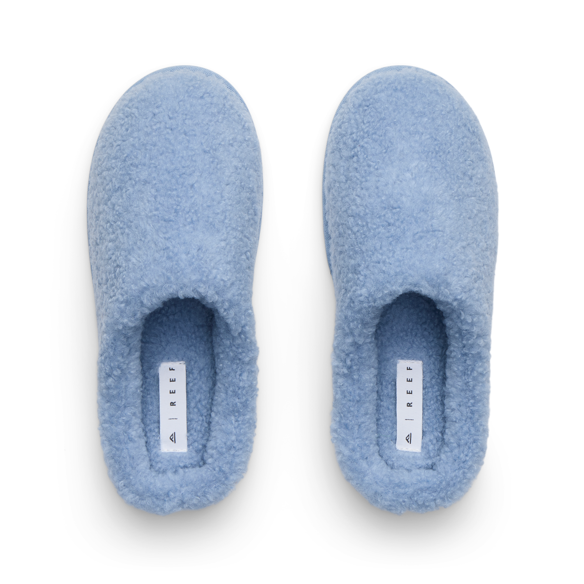Daydream Slipper pair viewed from above with toes facing upward and soft blue faux shearling lining