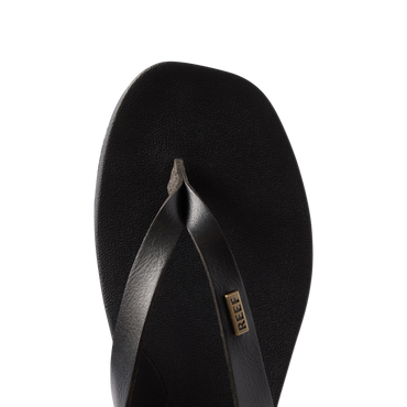 Vista Lune black women's flip flop facing forward, close-up on top view of cushioned, water-friendly footbed and straps.