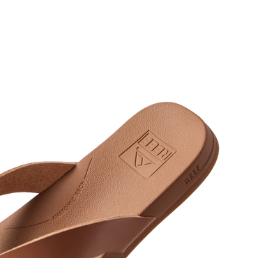 Close-up of the front right side of the tan Vista Lune sandal showing soft-rebound cushioning and anatomical arch support.