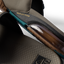 Close-up of tan and spruce slide midsole showing transparent REEFLEX foam cushioning and textured footbed details facing downward