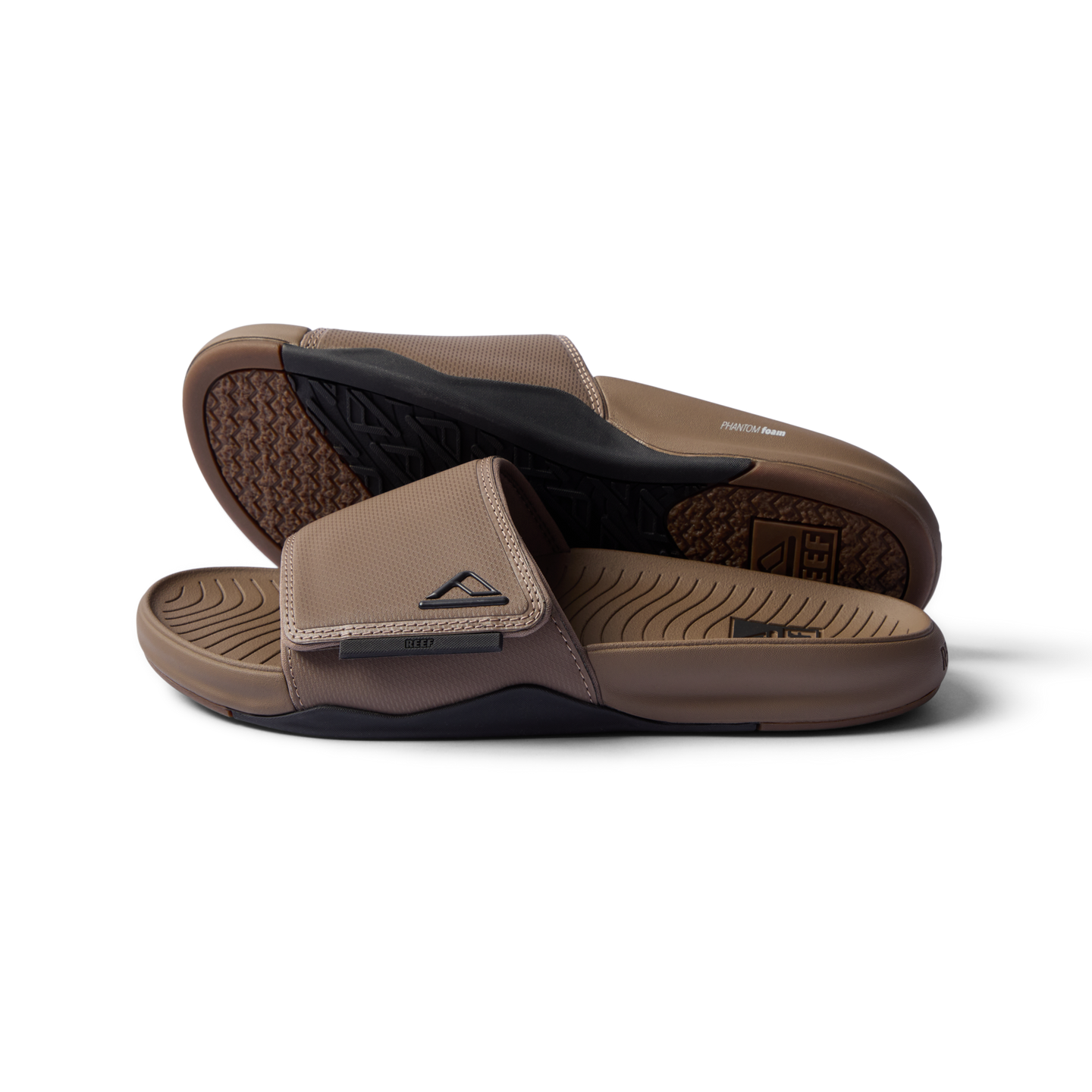 Phantom Slab men’s sandals in fossil black facing right showing footbed and top strap close-up, beach-inspired comfort footwear.