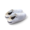 Reef Neptune women's white and black sneakers facing left, featuring breathable knit upper and cushioned sole for all-day comfort.