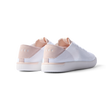 REEF Neptune women's white and blush sneakers facing backward showing heel with anatomical arch support and cushioning.