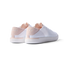 REEF Neptune women's white and blush sneakers facing backward showing heel with anatomical arch support and cushioning.