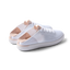 Reef Neptune women's white blush sneakers facing right, showing heel and side with breathable knit upper and cushioned sole.