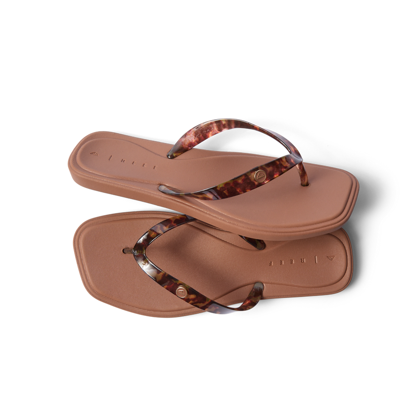 Solaye women's flip flops with tortoise shell straps, top view showing cushioned footbed and anatomical arch support.