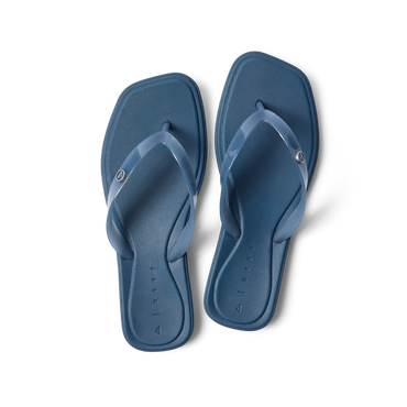 Solaye women's navy blue flip flops facing upward, featuring soft cushioning and anatomical arch support for beach comfort.