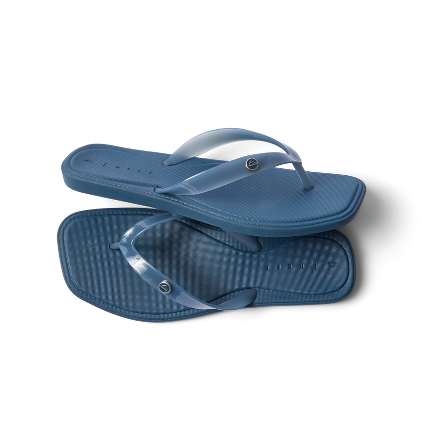 Solaye women's navy blue flip flops top and side view, surf-inspired comfort with cushioned arch support.