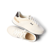 Pair of Shoreline Palisades sneakers in white and black, left shoe facing right, right shoe showing top close-up, surf-inspired comfort.