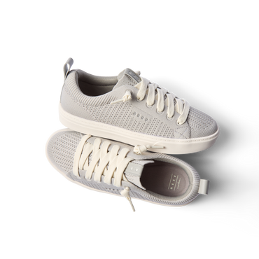 Lay Day Lite women's light gray sneakers top and side views showing knit upper, cushioned sole, and anatomical arch support