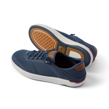 Pair of Laguna sneakers in navy with breathable mesh and rubber sole, left shoe facing left, right shoe showing sole details