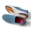 Del Mar Slip On blue slip on sneakers facing left, showing cushioned soles and easy on and off design