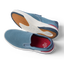 Del Mar Slip On blue slip on sneakers facing left, showing cushioned soles and easy on and off design