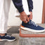 Shoreline Del Mar navy sneaker facing right, shown being worn for everyday walking