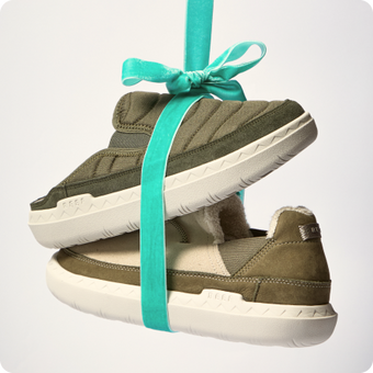 Olive green REEF shoes facing left, stacked and tied with a turquoise ribbon
