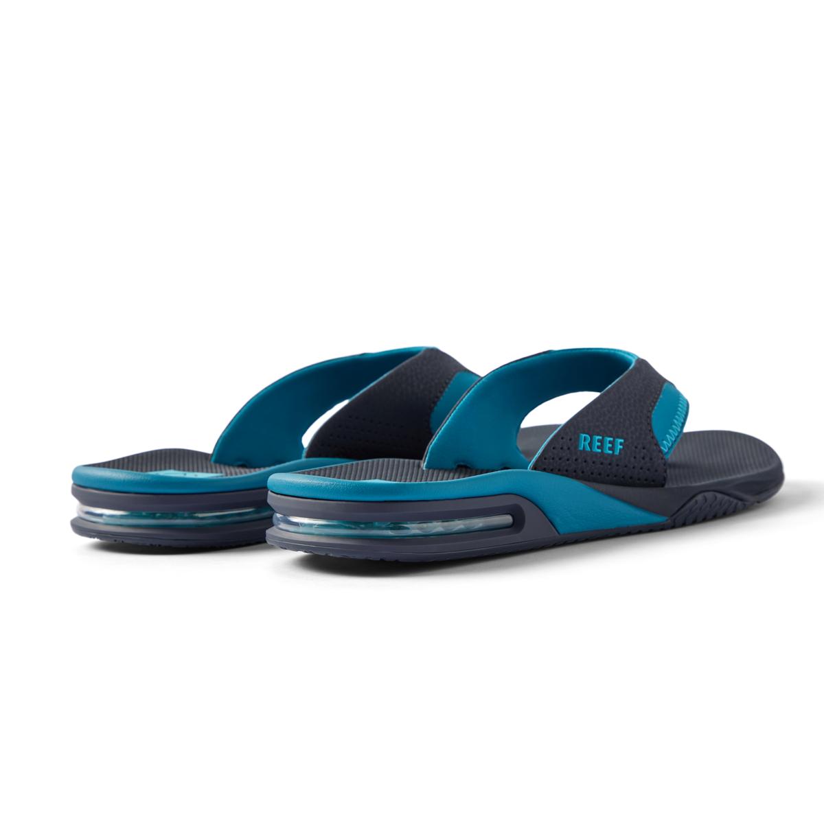 REEF Fanning water friendly flip flops facing left with cushioned footbeds and durable rubber outsoles