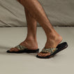 Fanning men's sandals facing right, showing side view with camo straps, soft cushioning, and anatomical arch support.