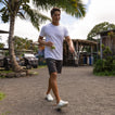 Glider white water friendly shoes facing forward on a man walking outdoors by the beach