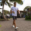 Glider white water friendly shoes facing forward on a man walking outdoors by the beach