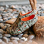 Glider water-friendly footwear facing left on beach stones, showing cushioned footbeds and molded comfort design