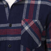 Close-up of the chest pocket and button placket on the navy and red Houston Flannel Shirt for men.
