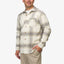 Man wearing Houston Flannel Shirt in almond milk color, front view showing chest pocket and buttons, casual style.