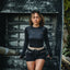 Woman wearing Robyn Short in black with beige waistband, front view, styled for an active beach lifestyle with comfort focus