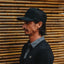 Side view of a man wearing the Tonal Townsend Hat, showcasing its surf-inspired, comfortable design for men.
