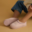 Indie Slipper in pink side view with the toe facing left padded collar and lightweight cushioned sole