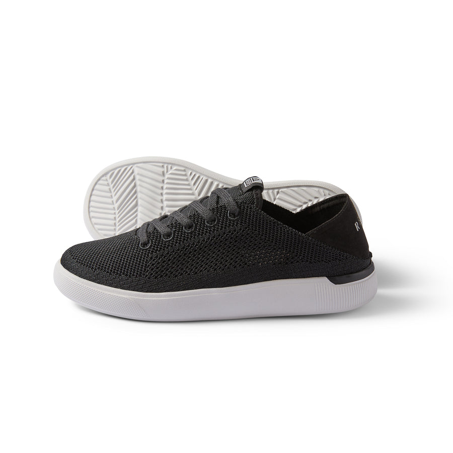 Kids Neptune black sneaker shown from side and bottom, lightweight and breathable with anatomical arch support and soft cushioning.