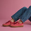 Side view of women's Lay Day Seas sneakers in red with gum soles, showcasing comfort and beach-inspired style.