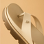 Vista Luxe Vivianahh sandal close-up of beige toe post and cushioned insole facing left, highlighting comfort and durability.