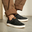 Laguna black sneakers facing right with breathable mesh uppers and cushioned soles