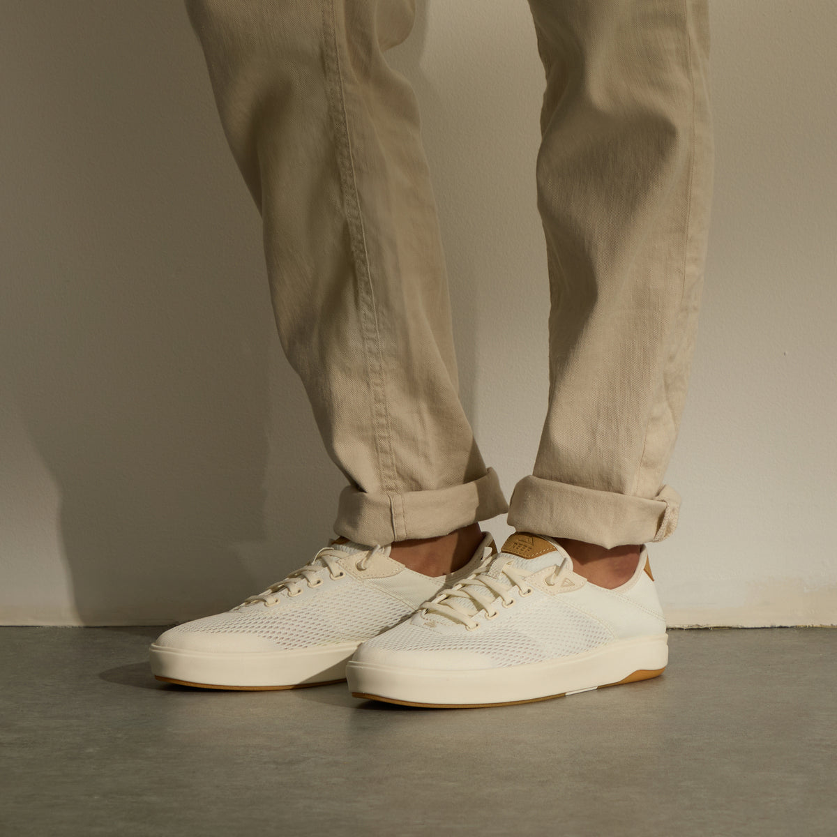 Laguna white sneakers facing left with breathable uppers and cushioned comfort