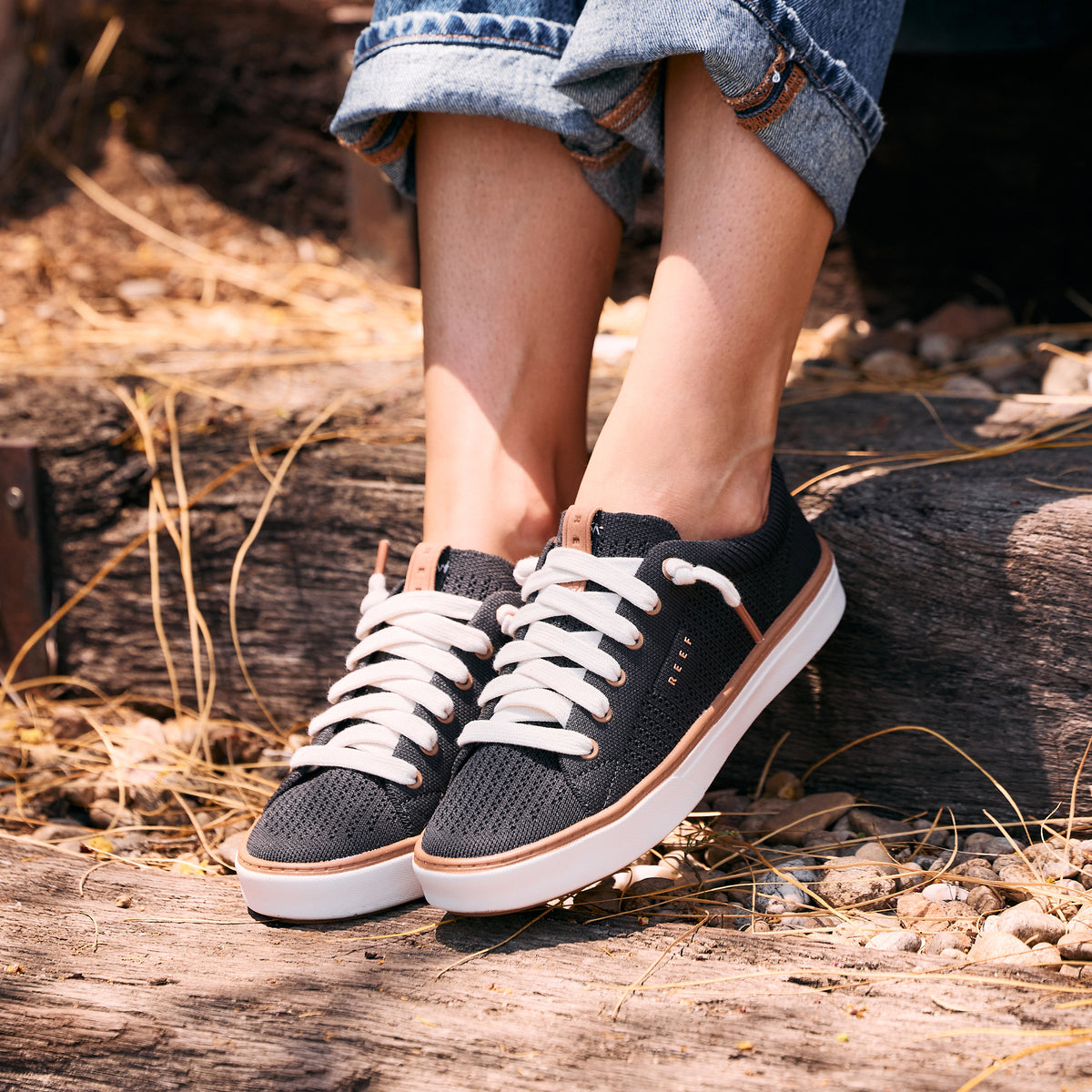 Lay Day Lite black sneakers facing left, featuring cushioned soles and breathable uppers for everyday comfort